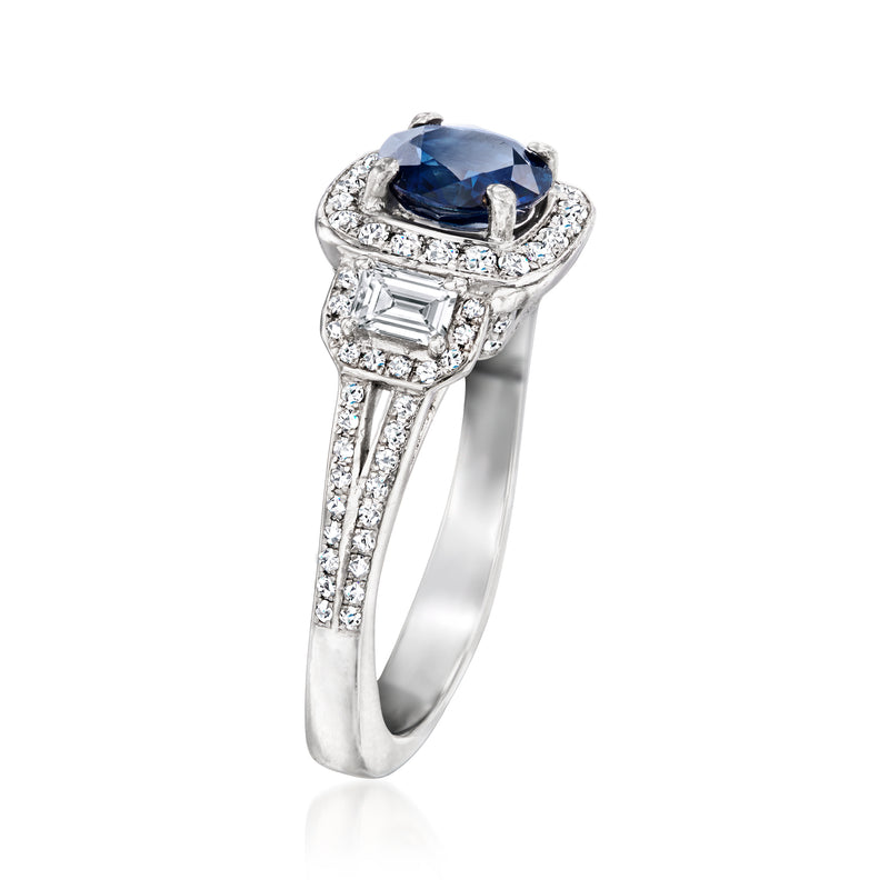 Platinum ring with large oval blue sapphire center and diamond halo plus baguette sides