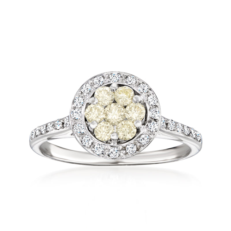 Yellow and white diamond cluster ring with oval halo, white gold band
