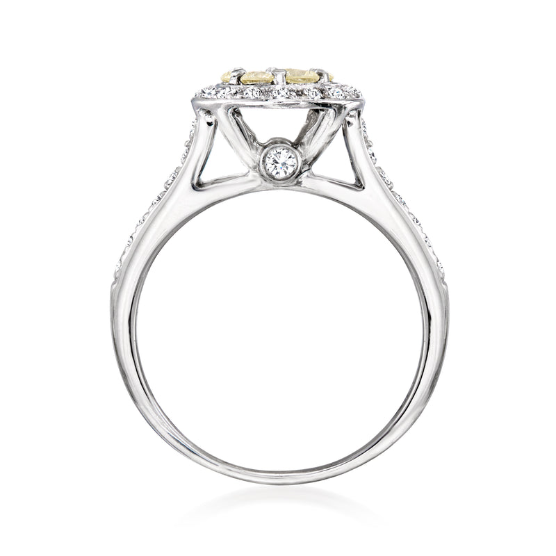 White gold ring with openwork top and round diamond in the center