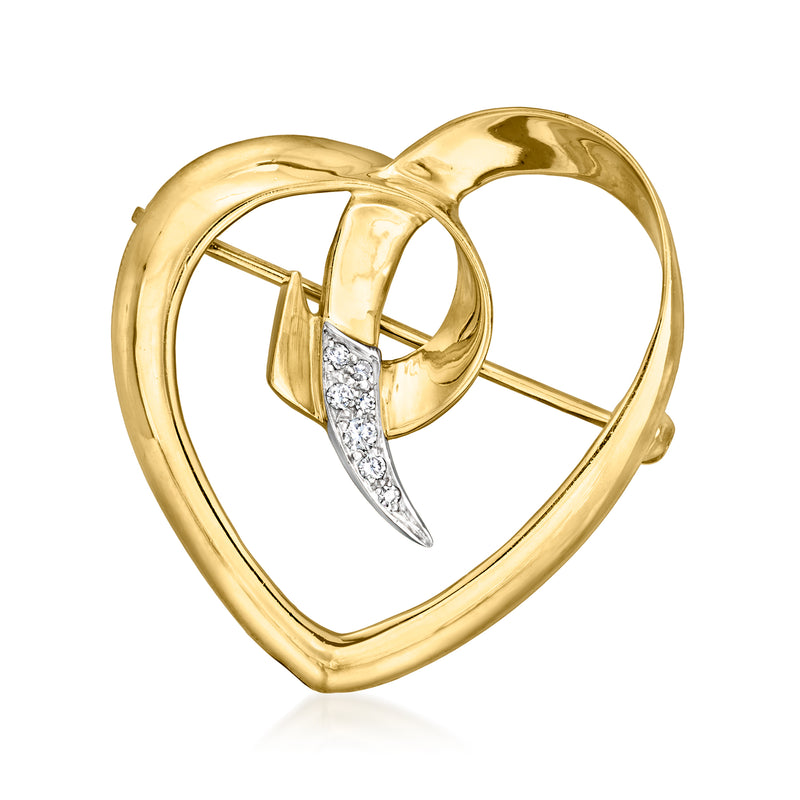 Vintage 18kt yellow gold heart pin with diamond-set bow and prong clasp