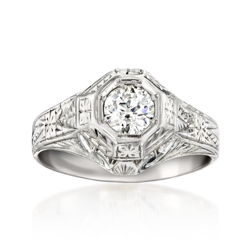 Vintage 18kt white gold diamond ring with round center stone and engraved band
