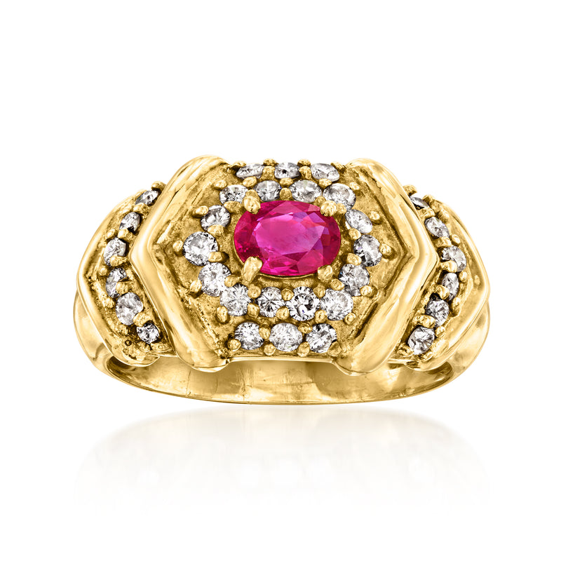 Vintage gold ring with oval ruby center and halo of sparkling diamonds