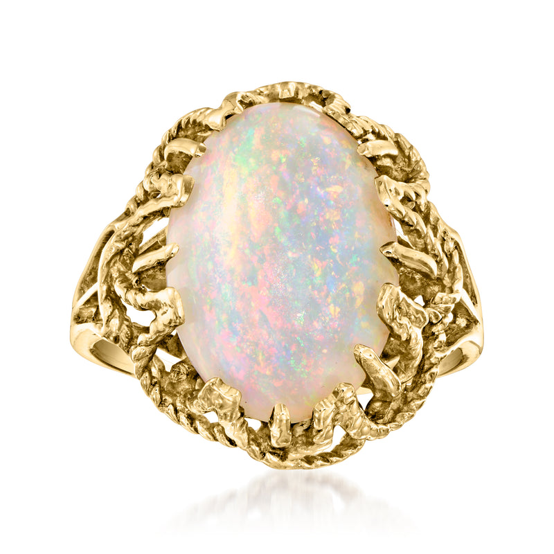Vintage opal ring in 14kt yellow gold, oval opal with ornate prong setting.