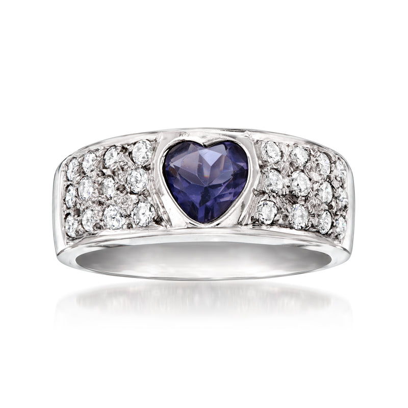 Vintage white gold ring with blue iolite center and round diamond halo band