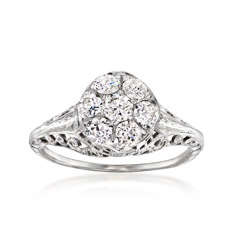 Vintage diamond cluster ring in white gold, oval center with side marquise accents