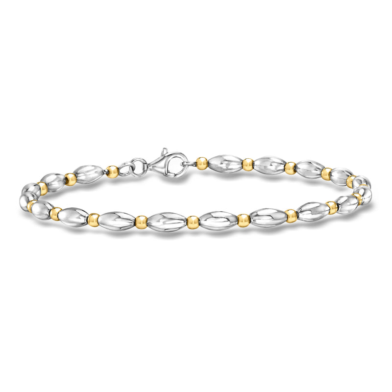 Silver link bracelet with oval links and gold over round accents