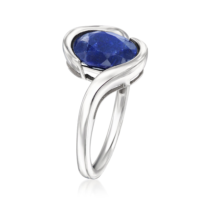 Sterling silver ring with blue oval gemstone in bezel setting, slim open band