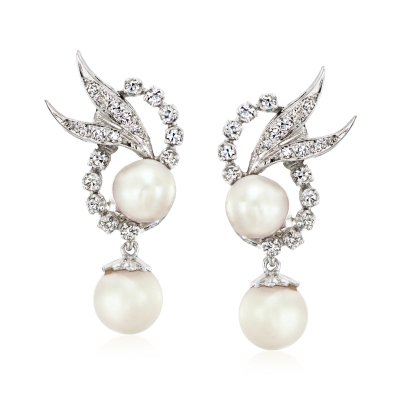 Cultured pearl and diamond drop earrings in white gold, with two dangling round pearls.
