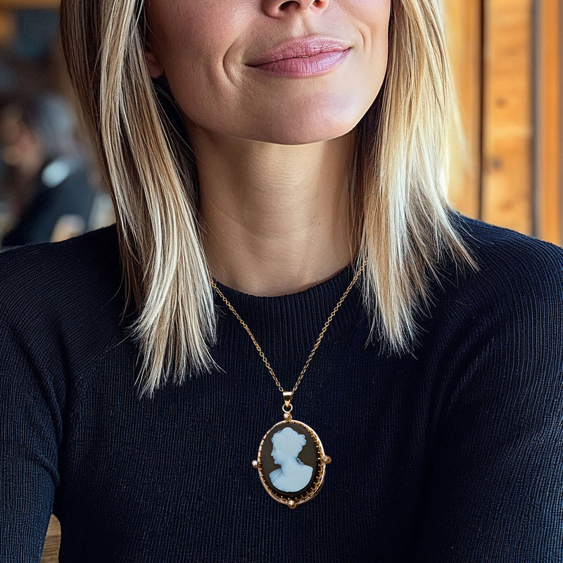 Yellow gold cameo pendant necklace on chain, oval dark agate with blue profile detail