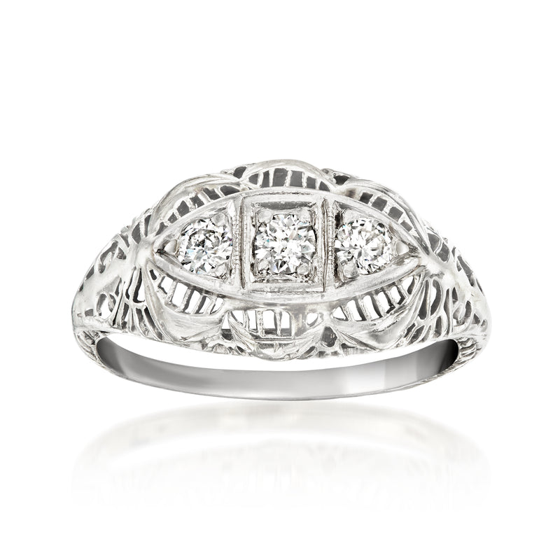 Vintage diamond filigree ring in white gold with three round-cut stones