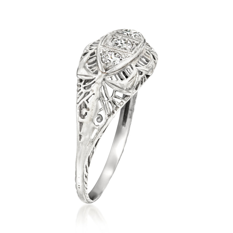 Side view vintage white gold filigree ring with round-cut center diamond