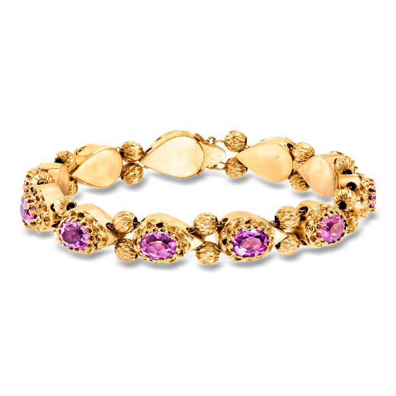 Yellow gold amethyst slide bracelet with oval and round purple gemstones, hinged links