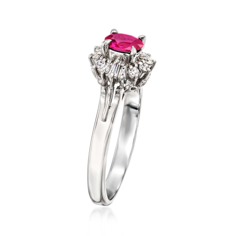 Platinum ring with ruby centerpiece held by prongs and diamond side accents