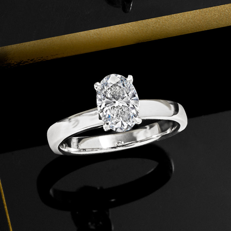 14kt white gold wide ring with oval lab-grown diamond in raised four-prong setting