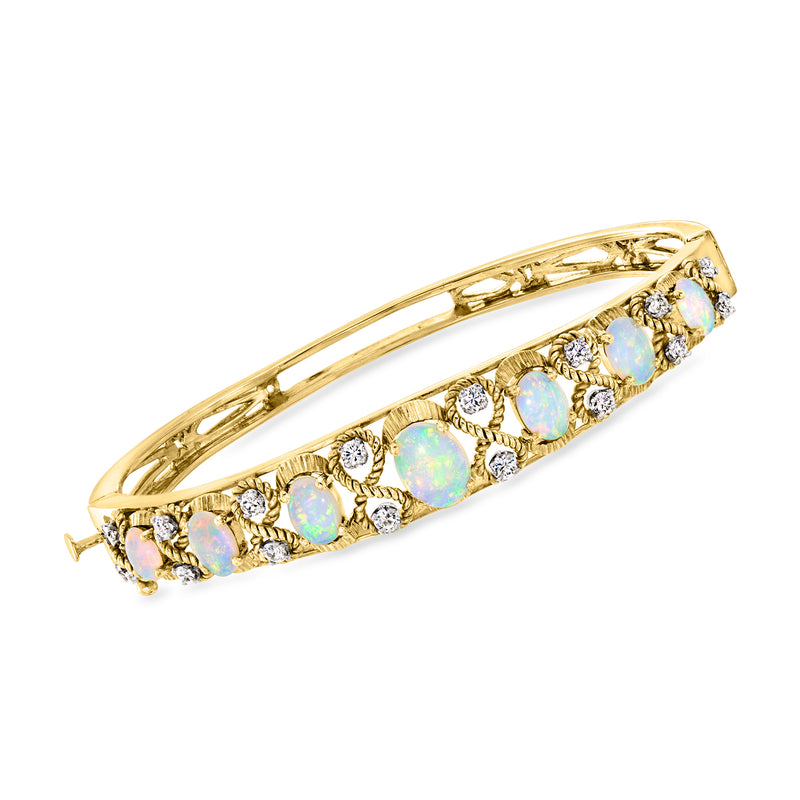 14kt yellow gold vintage bracelet with opal cabochons and diamond accents, hinged bangle