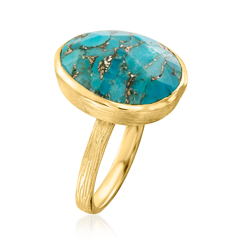 Round turquoise cabochon ring with gold-tone bezel and textured split shank