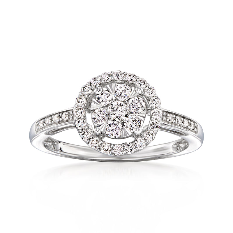 Diamond cluster ring in 14kt white gold with round halo and pavé band