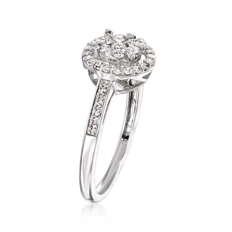 Vintage diamond cluster ring in white gold with split shank and pavé band