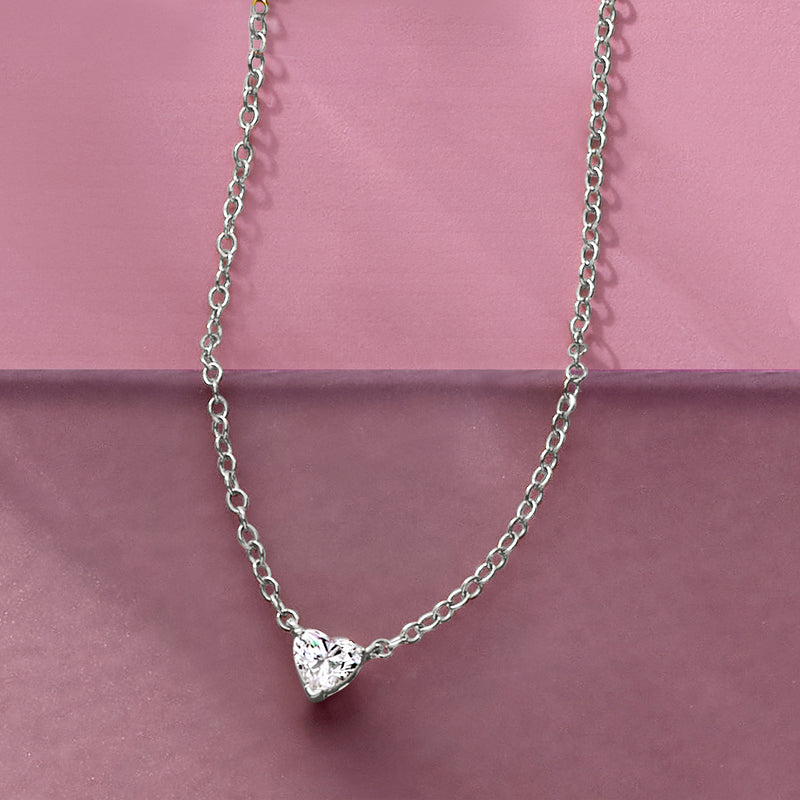 Heart-shaped diamond solitaire necklace on model, fine 14kt white gold chain
