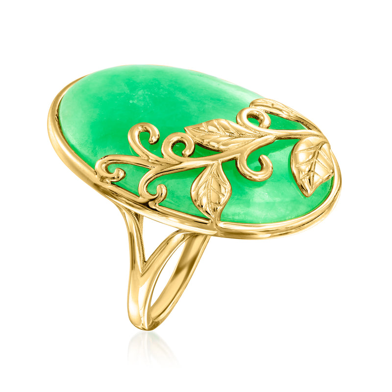 Gold-toned open ring with green oval stone and vine leaf scrollwork on the band.