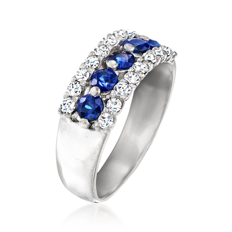 Platinum vintage sapphire and diamond ring, oval blue stones in halo
