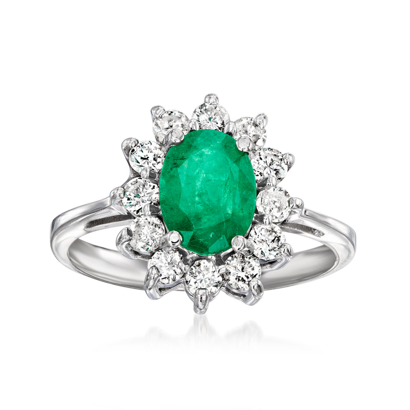 Oval green emerald center ring with diamond halo, set in 14kt white gold