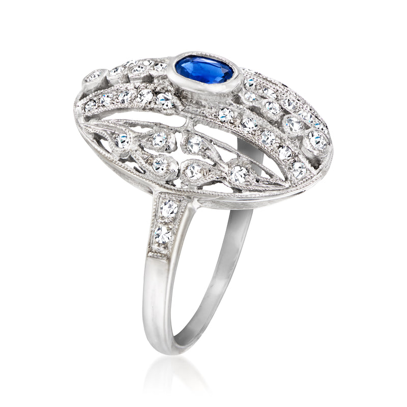 18k white gold ring with oval blue sapphire and halo of round diamonds, side view