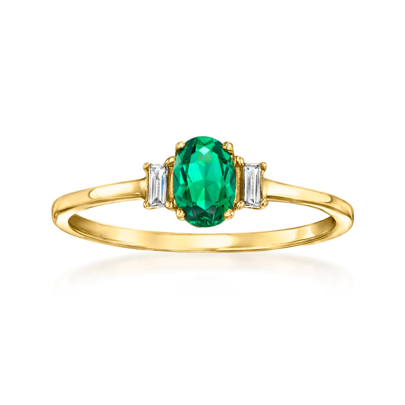 Gold emerald-cut green gemstone ring with baguette diamond side stones