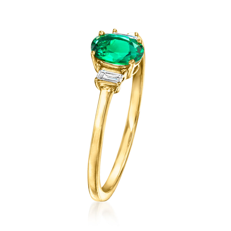 Yellow gold ring with large green emerald-cut center stone and diamond accents