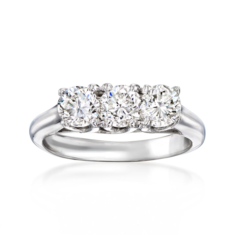 Three-stone diamond ring with white gold band and three round-cut stones