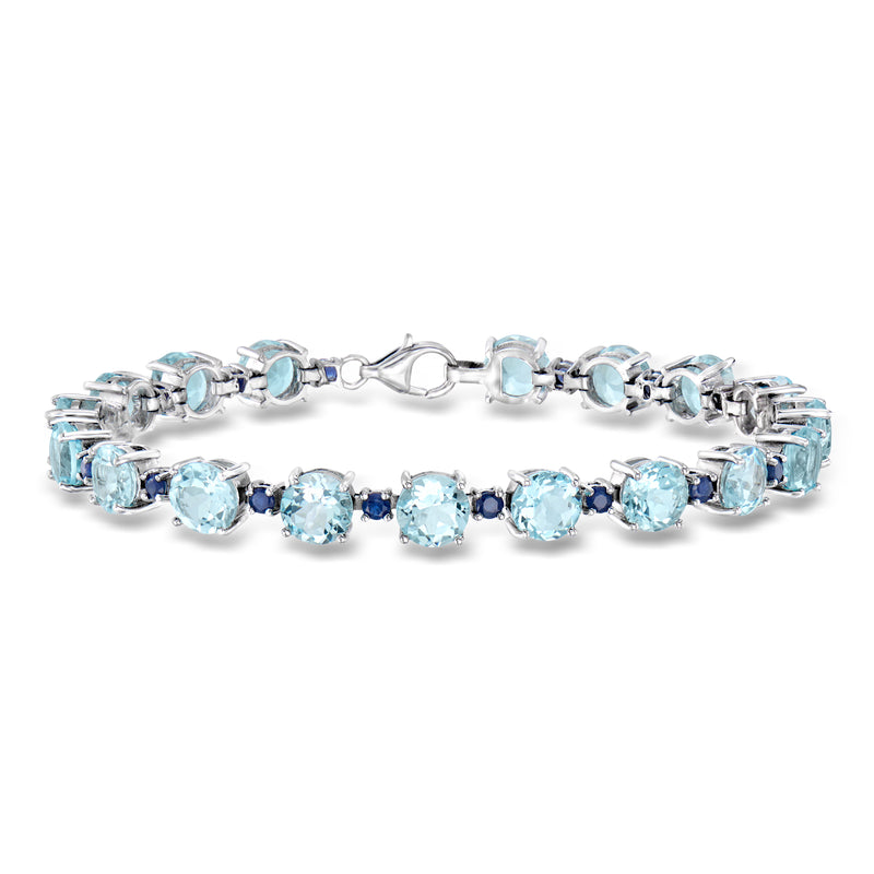 Sterling silver tennis bracelet with oval sky blue gemstones and hinged clasp