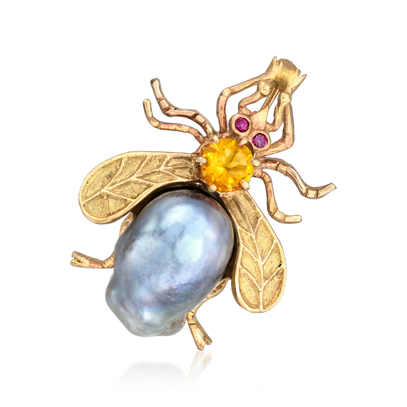 Yellow gold bug pin with black cultured pearl body, citrine head, and ruby accents