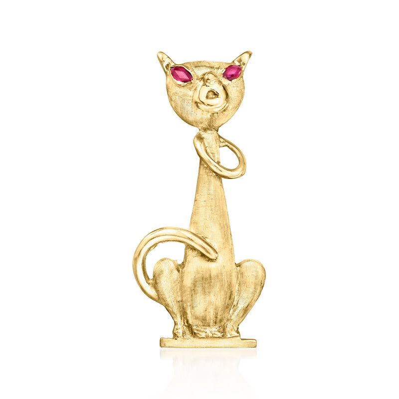 Vintage yellow gold cat pin with ruby eyes and curved tail