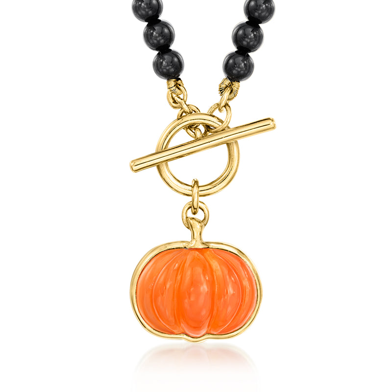 Gold toggle necklace with black bead strand and orange pumpkin charm