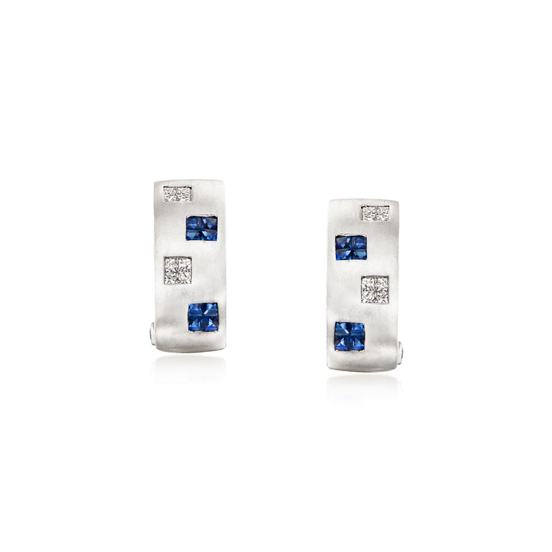 Curved white gold clip earrings with blue sapphire and small diamond accents