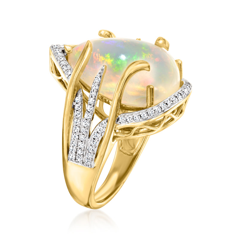 Side view of teardrop opal ring in 14kt yellow gold with diamond accents