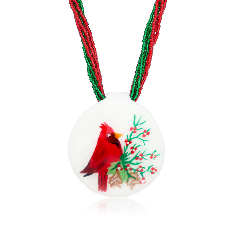 Multistrand cardinal pendant necklace with red/green bead strands and round glass charm