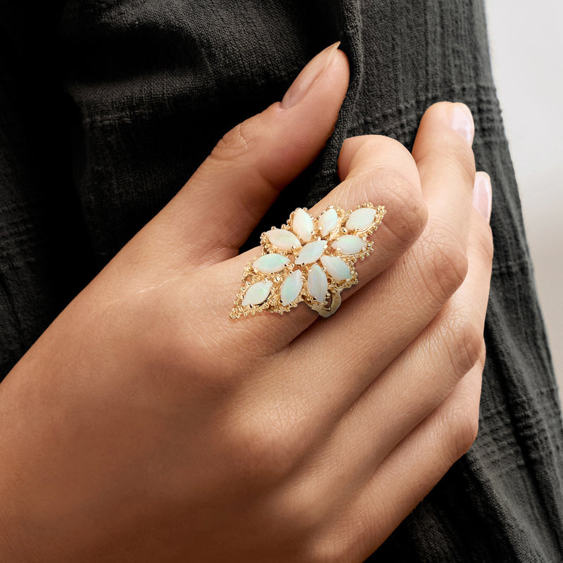 Opal cluster ring on hand, 14kt yellow gold with teardrop opal cabochons