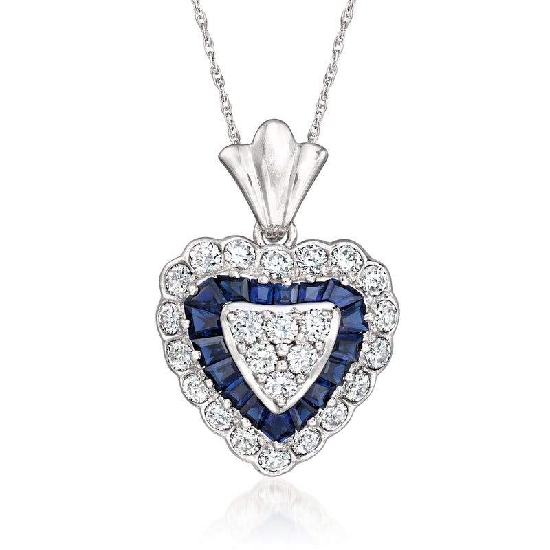Platinum heart pendant necklace with blue sapphire center and diamond halo