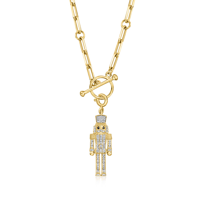 Gold-tone nutcracker charm with black-and-white diamond accents on chain