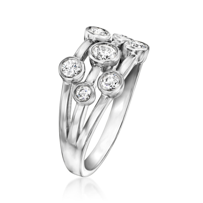 Sterling silver ring with bezel-set round diamonds on an openwork split shank