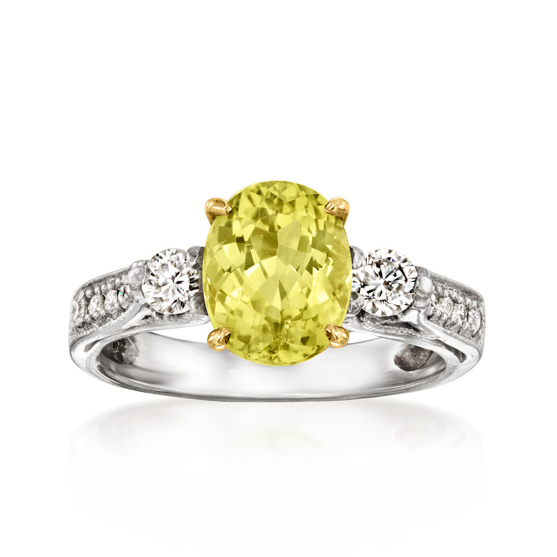 Oval green tourmaline ring with diamond pave shoulders and yellow gold prong setting
