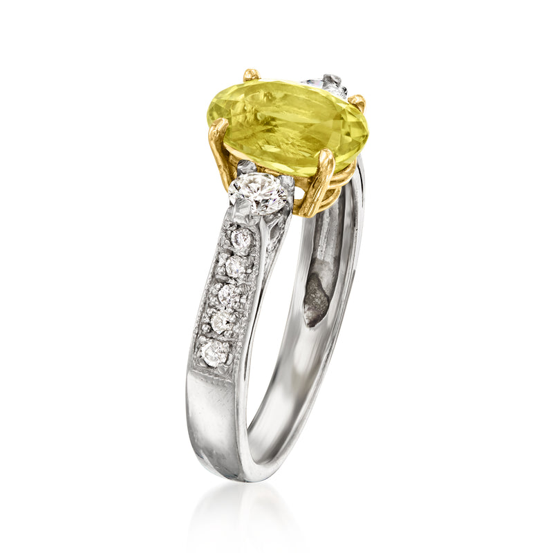 Platinum ring with yellow gold prongs, oval green tourmaline and raised diamond side rows