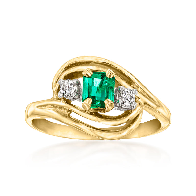 14kt yellow gold ring with emerald center stone and diamond side stones