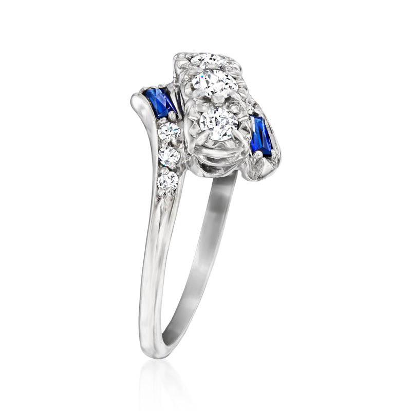 White gold vintage ring with large center crystal and two blue square accents, side view