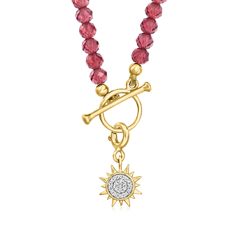 Garnet bead toggle necklace detail: gold toggle clasp, sun charm with crystal center