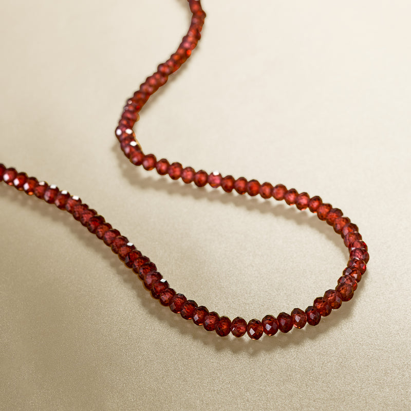 Faceted garnet bead necklace strands with gold toggle clasp