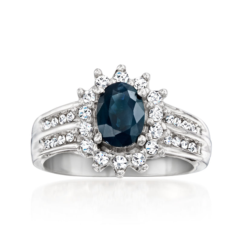 14kt white gold sapphire and diamond cluster ring with dark blue oval center stone