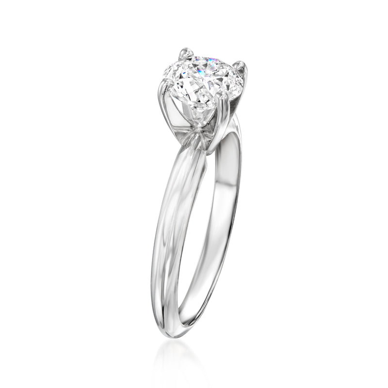 White gold solitaire diamond ring with round center stone, angled side view