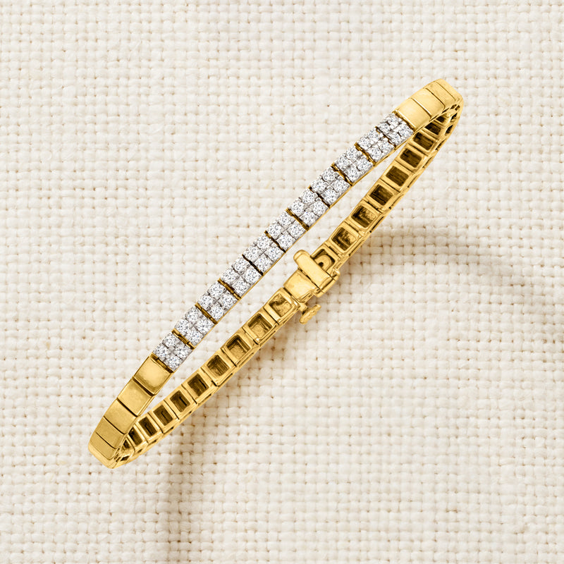 Gold square-link bracelet with straight row of clear stones, side view
